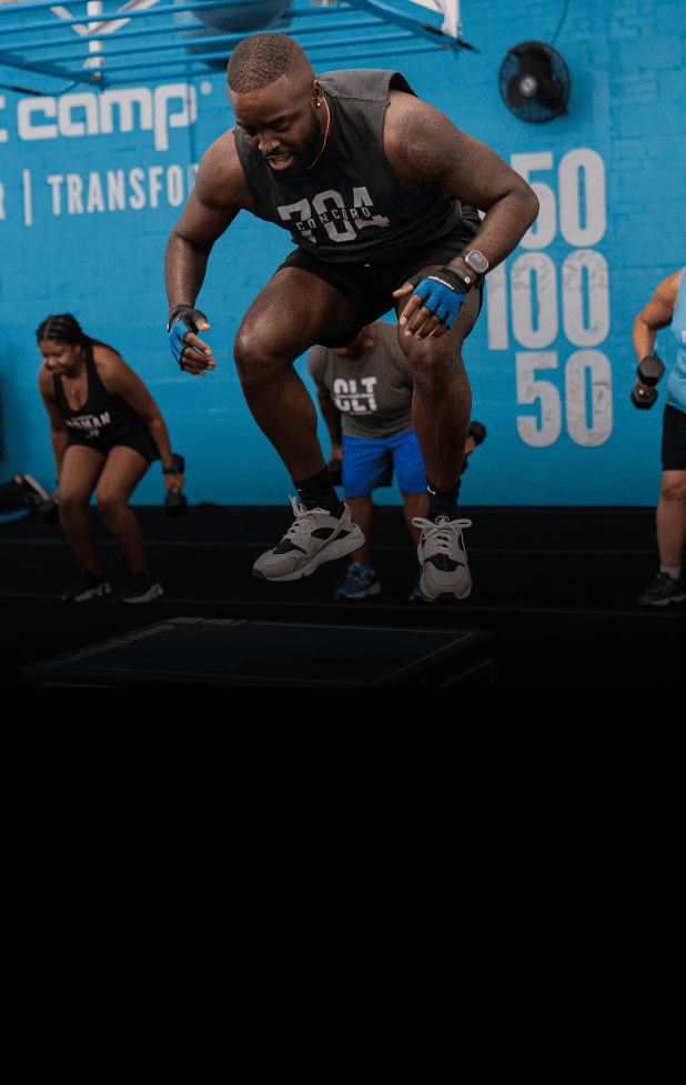 a male burn boot camp member jumping