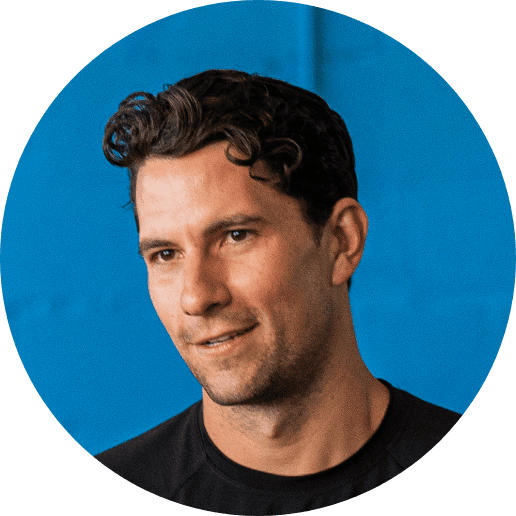 a male with wavy hair and a black tshirt