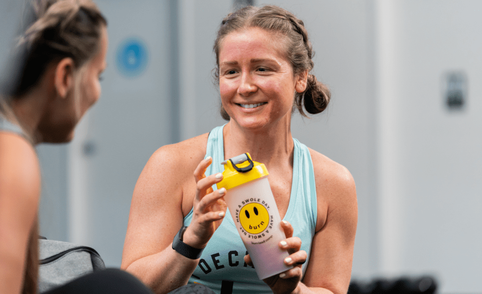 a burn boot camp member drinking a smoothie